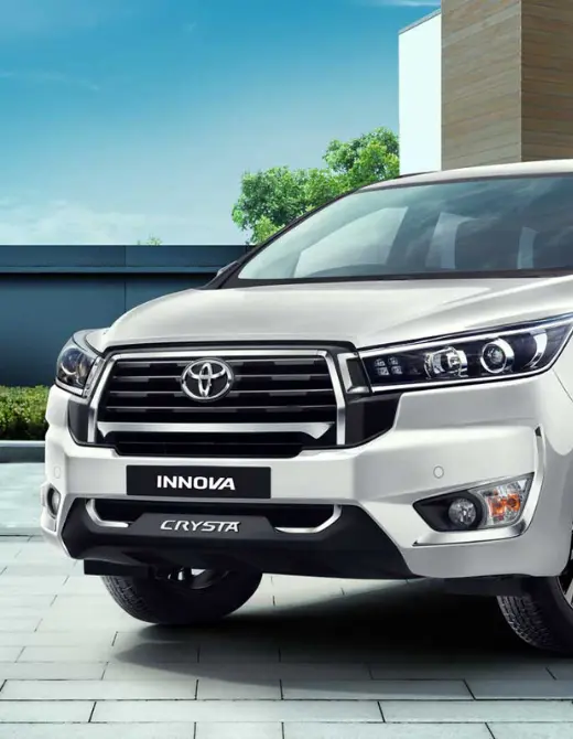 Toyota Innova from Just Cab Hire on a scenic road at sunrise